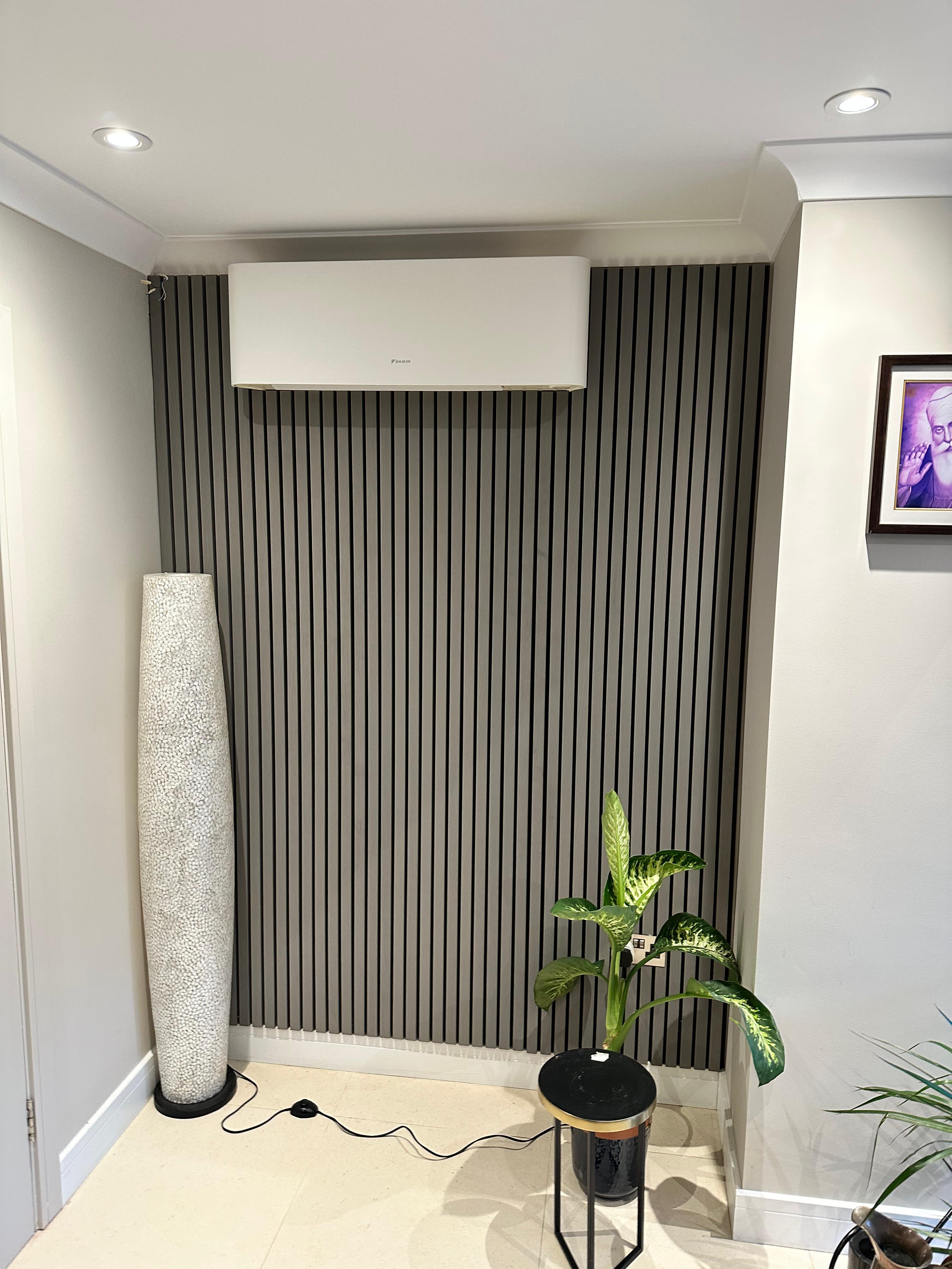 Modern grey slat wall paneling with integrated air conditioning