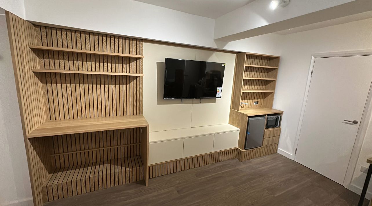 Bespoke oak media unit showcasing quality carpentry craftsmanship
